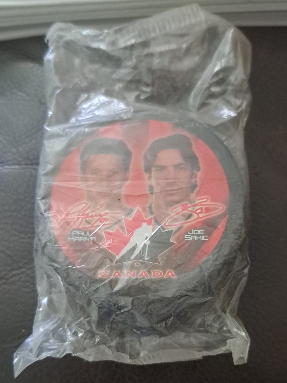 McDonald's Black and Red Canada Hockey Puck Featuring Paul Kariya & Joe Sakic